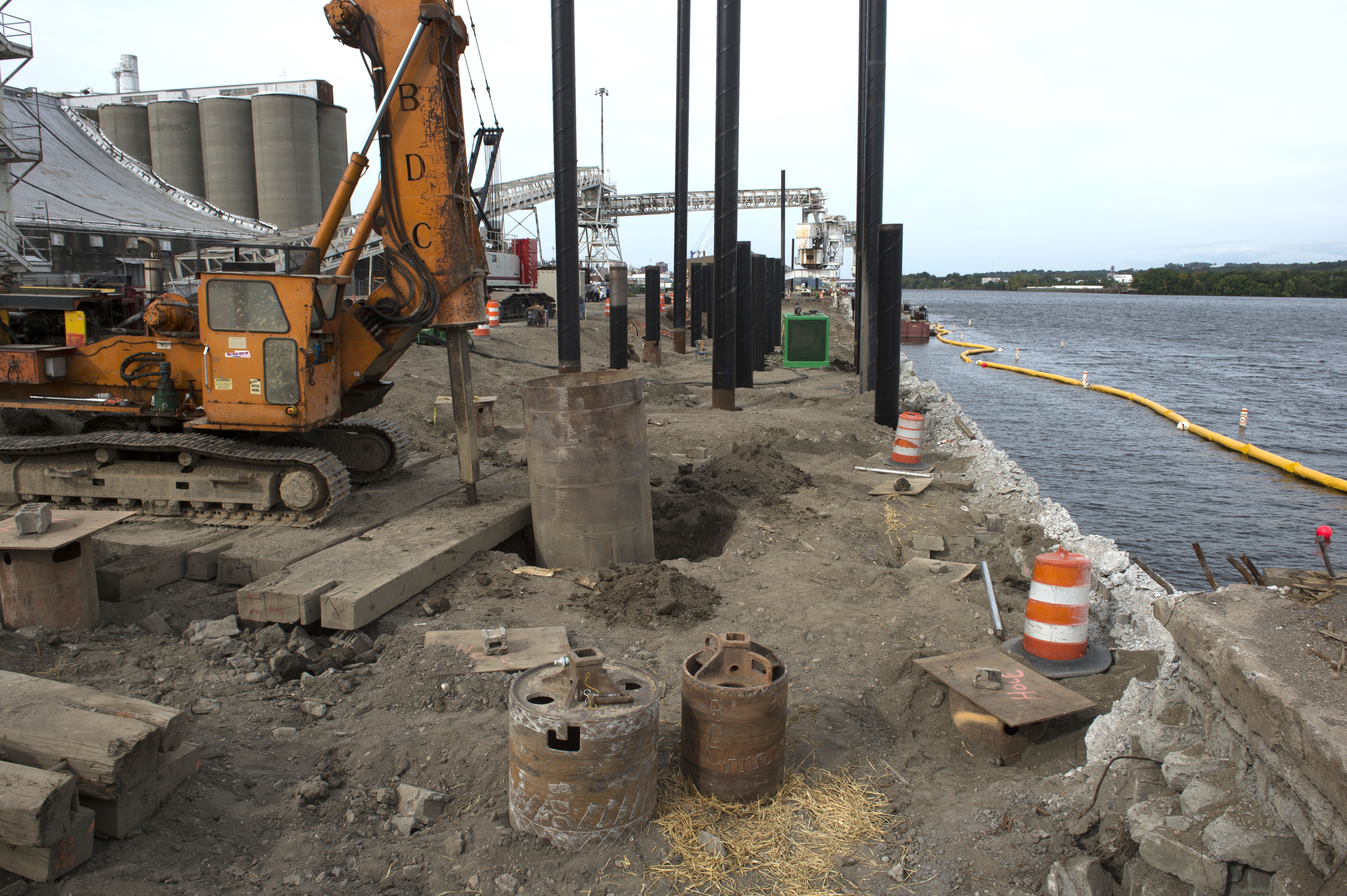 Construction at the South wharf with Ardent Mills and boom in the Hudson River